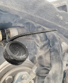 A Rooster® Asset Tracker in a lanyard